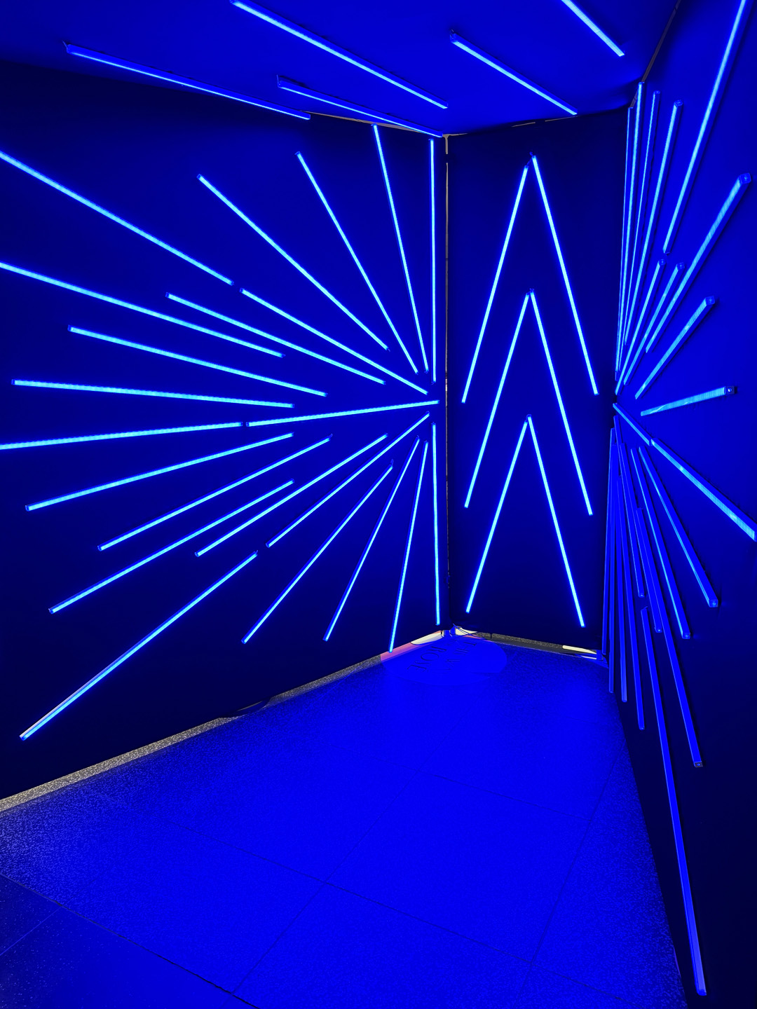 Interior of the Vogue Booth illuminated with blue LED light strips