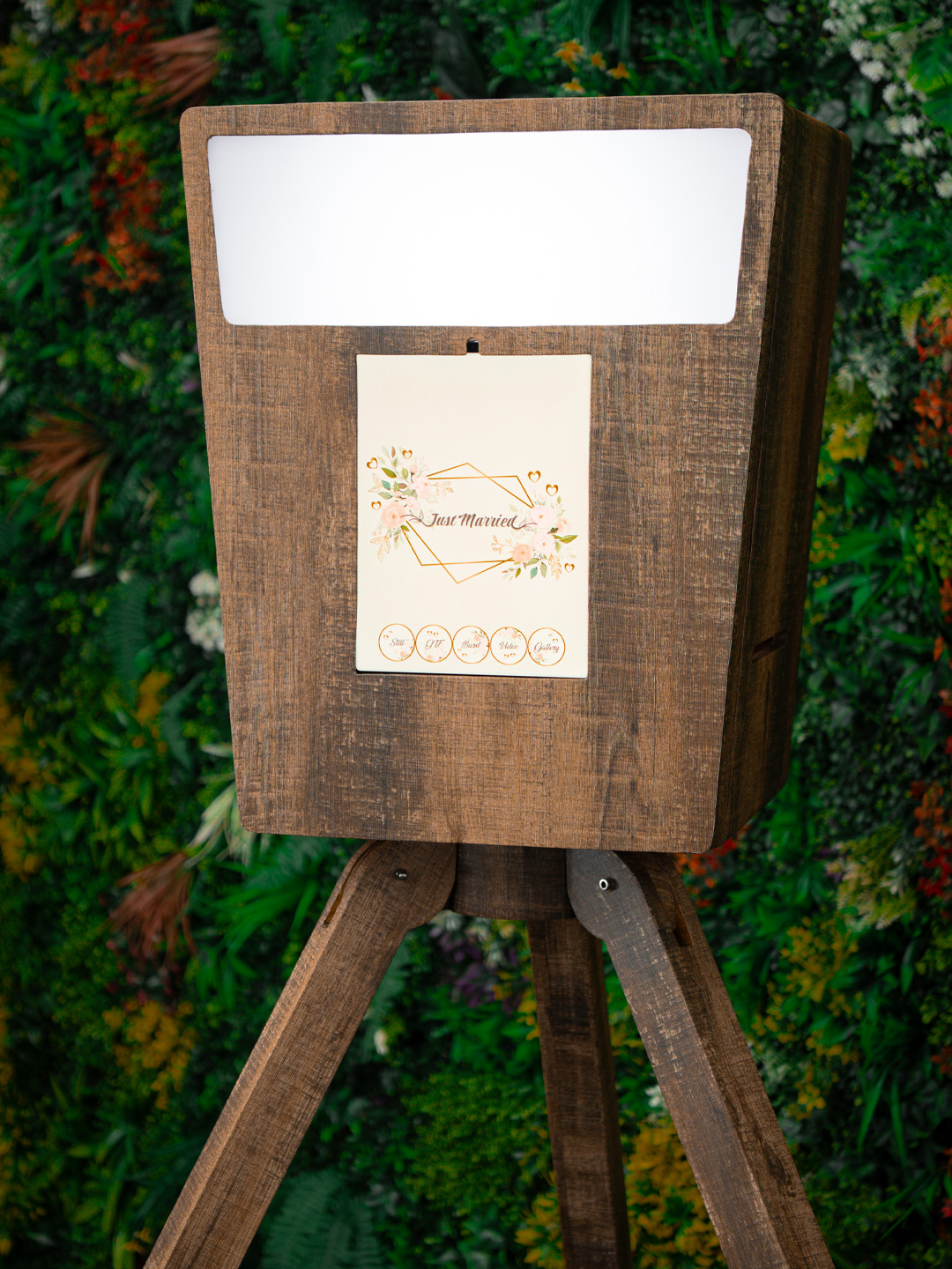 Close-up of the wooden digital Vintage Booth with a Just Married touchscreen