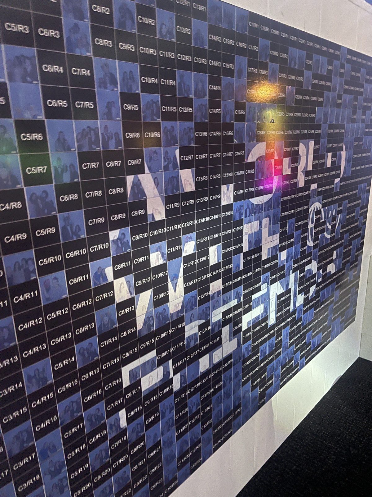 Close-up of photographs forming a branded event mosaic wall