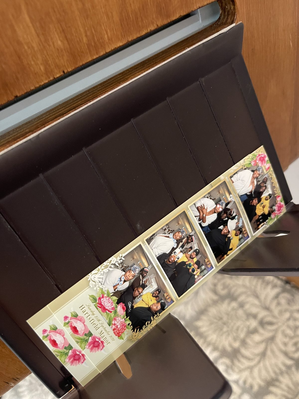 Personalised wedding photo strips displayed together on a table