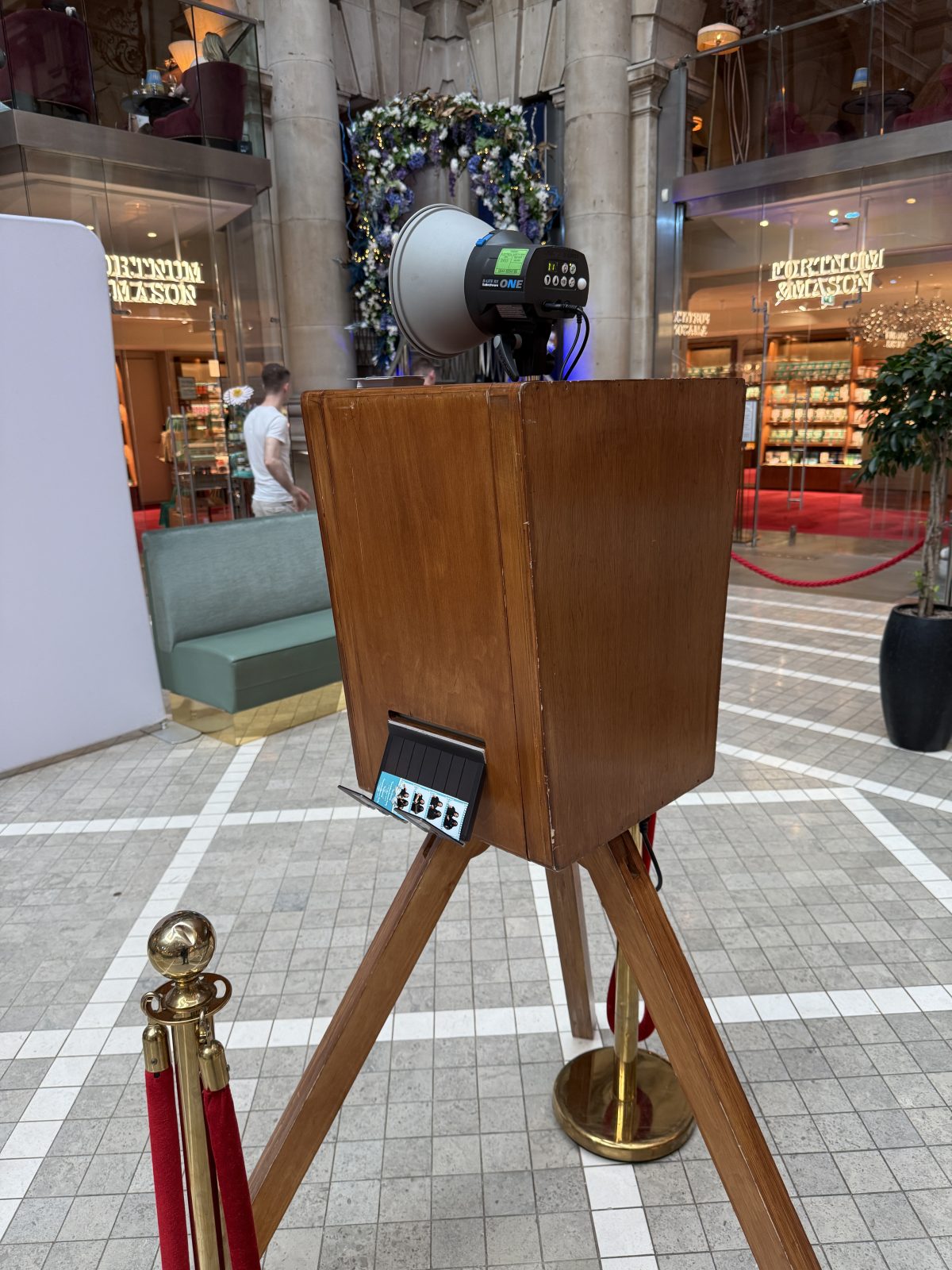 Wooden photo booth ready for guests in a rustic wedding venue